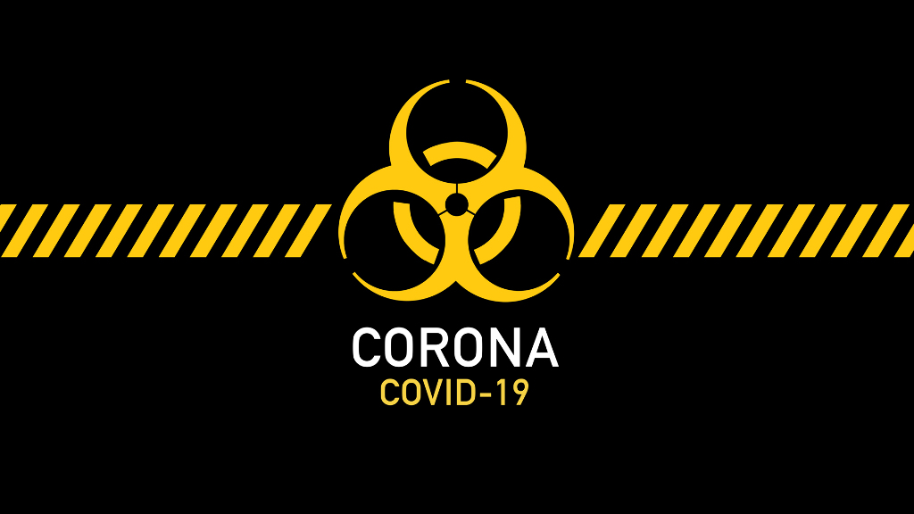 Sie sehen ein schwarze Fläche auf der groß das international Zeichen für Biogefährdung zu sehen ist. Darunter sind die Schriftzüge „Corona“ und „COVID-19“ zu lesen.