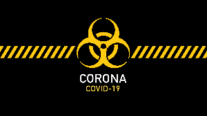 Sie sehen ein schwarze Fläche auf der groß das international Zeichen für Biogefährdung zu sehen ist. Darunter sind die Schriftzüge „Corona“ und „COVID-19“ zu lesen.