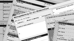 Sie sehen verschiedene Seiten eines Wohngeldantrages.